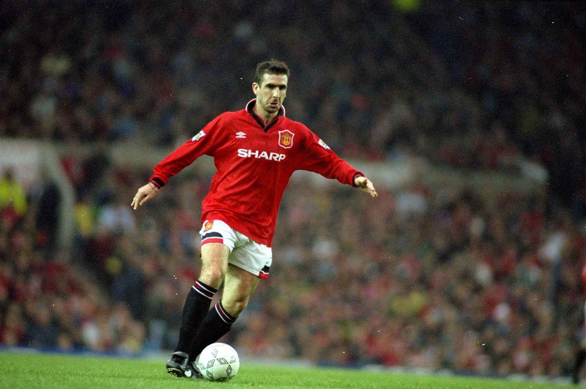 Eric Cantona in action in the Premier League